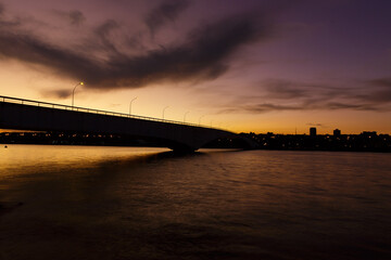 a beautiful view of the Costa e Silva bridge at dusk in Brasilia, Brazil.