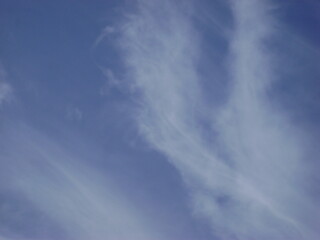 striped clouds against a blue sky