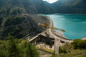 crane on a dam in the mountains