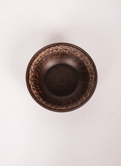 Ceramic ware isolated on a white background. Single rustic clay bowl. 
