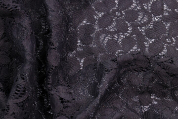 a Curve of Dark Grey Lace Fabric on White Background