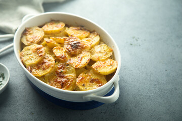Traditional homemade potato gratin with cheese