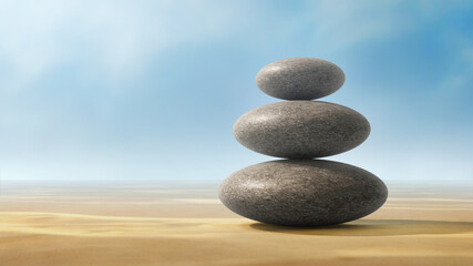 A stack of three zen stones balanced on a sandy background and soft blue sky. 3d Render