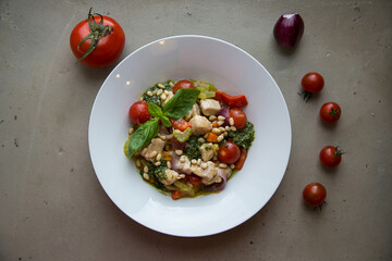 Italian stewed vegetables with cherry tomatoes and pine nuts
