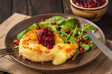 Fried camembert cheese and cranberry sauce.