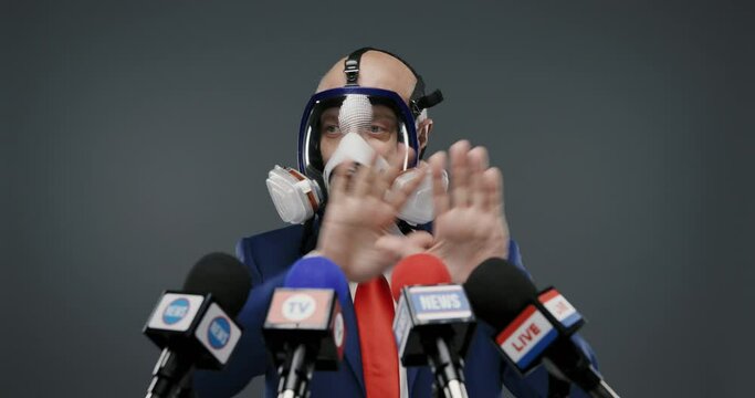 Politician wearing a respirator and giving a speech