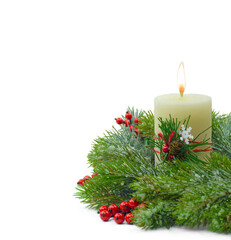 New Year's decor. Christmas composition: spruce branches with a candle and tinsel. Isolated on white. Copyspace.