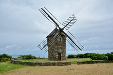 Fototapeta na wymiar Old windmill in Normandy built in granite stones 