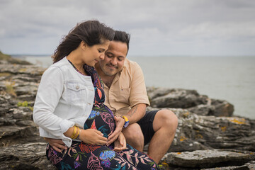 Fototapeta na wymiar married couple pregnant at sea