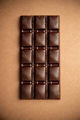 chocolate bar on brown background