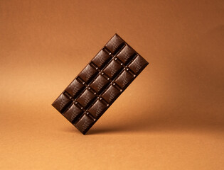 chocolate bar on brown background