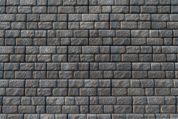 Gray retaining blocks forming a large wall wide view - 392260132