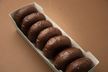 chocolate bagel on brown background
