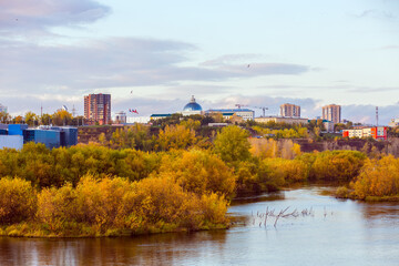 Fototapeta premium Golden autumn in the city, on the banks of the river. 