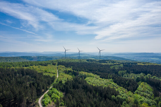 Drone panorama over forest and wind turbines in Germany