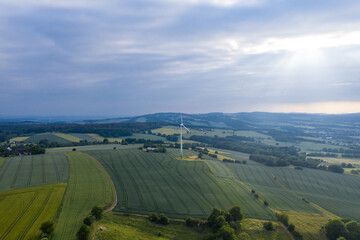 Fototapeta na wymiar Drone panorama over landscape and wind turbine in Germany