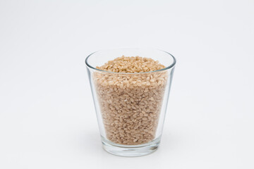 Brown rice, unpolished rice transparent glass cup