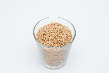 Brown rice, unpolished rice transparent glass cup
