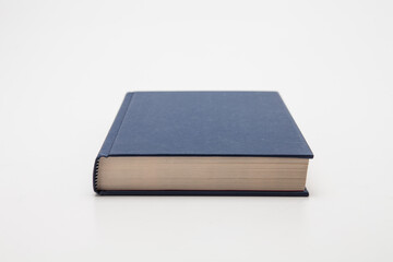 Dark blue book on white background