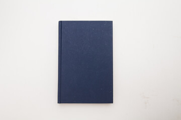 Dark blue book on white background