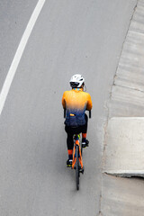 Overhead shot of an amateur male cyclist on the road between Bogota and La Calera on the mountains in Colombia