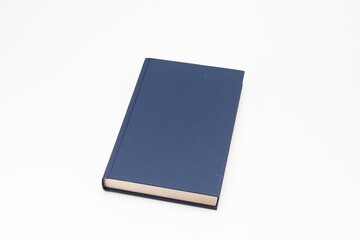 Dark blue book on white background