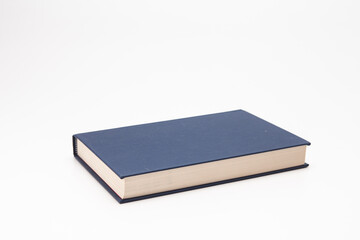 Dark blue book on white background