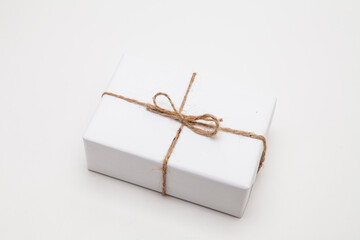 Parcel in white wrapping paper isolated