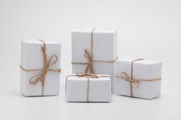 Parcels in white wrapping paper group isolated