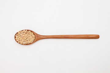 Wooden spoon with brown rice unpolished rice