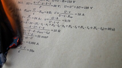 Burning Old Sheet of Paper with Mathematical Formulas and Equations