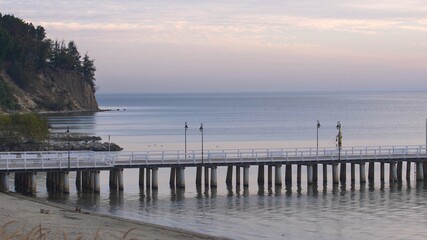 Fototapeta na wymiar Wooden Pier on Baltic Sea in Gdynia Poland at Sunrise Minimalistic View