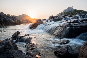 waterfall in the mountains at evening