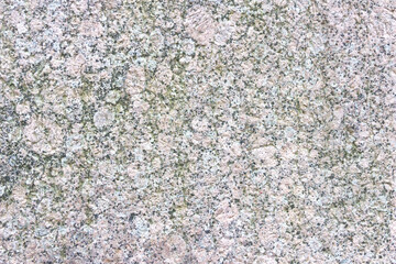 Texture of motley granite gray and red slab.