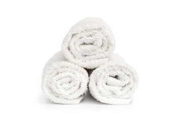 stack of white clean towels rolled up on white background