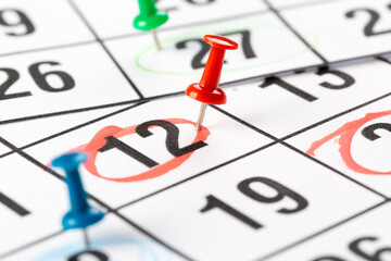 Thumbtack in calendar concept for busy, appointments and meeting reminders