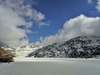 snow covered mountains in winter in famous tourist place in  songmo Lake, sikkim, India