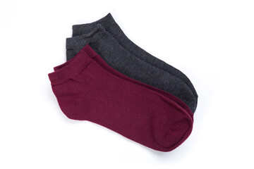 two pairs of colored short socks on a white background, top view