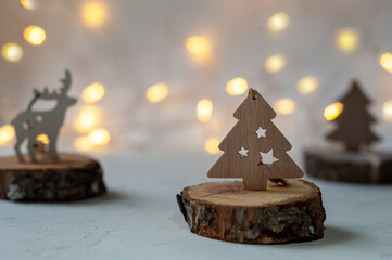 Wooden Christmas tree with bokeh on a white background.The mood of Christmas.