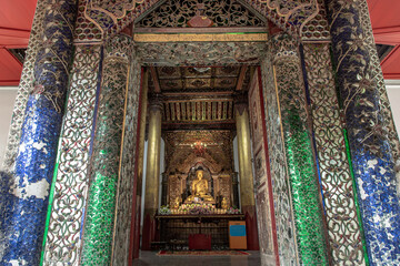 Fototapeta na wymiar Lampang, Thailand - Sep 04, 2019 : The buddha image within Sri Chum Temple Is an old Burmese style architecture. Selective focus.