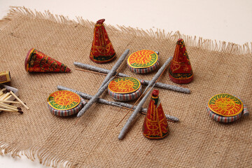 diwali firecrackers arranged in tick tack toe game form isolated on jute.