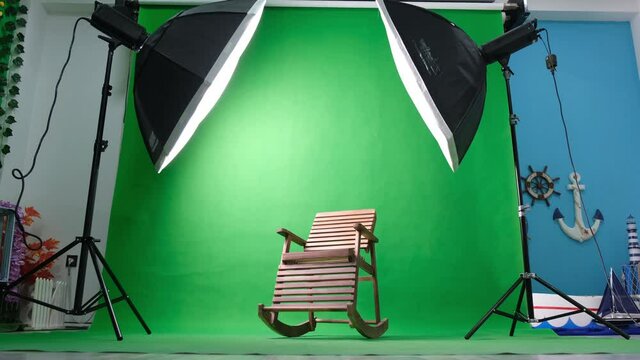 Photo or video studio with two hexagone studio lights. Green screen and rocking chair
