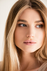 Obraz premium young blonde model looking away isolated on white