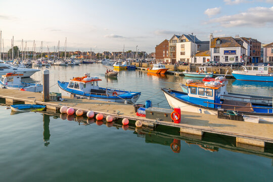 View of harbour boats and quayside houses, Weymouth, Dorset