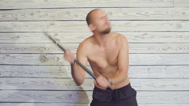 aggressive maniac killer with an ax indoors
