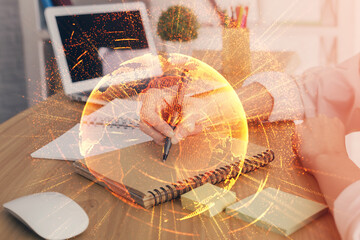 Social network theme hologram over woman's hands writing background. Concept of international people connect. Double exposure