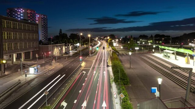 4k time lapse of traffic on highway with red and white lighttrails and setting moon near Amsterdam, the Netherlands