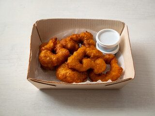 Picarones, Peruvian Dessert made from Squash and Sweet Potato and Served in a Doughnut Form with Syrup made from Panela