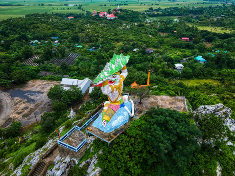 Lopburi, Thailand - October 9,2020 : Wat Khao Samo Khon, Buddha Monkey statue. aerial photograph. Famous historic for tourist travel in Lopburi..