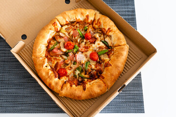 Pizza for one person. Mini pizza in a box. Food delivery